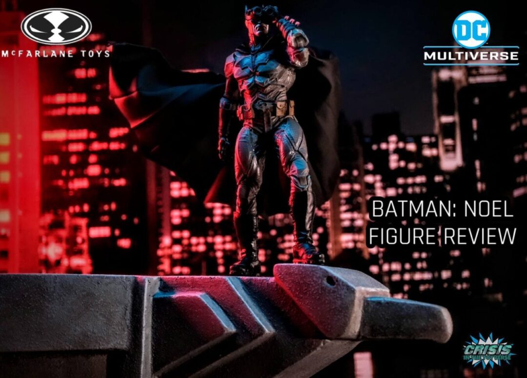 Batman: Noel action figure perched on a rooftop ledge, overlooking a detailed cityscape, showcasing dynamic posing and McFarlane Toys' intricate sculpt and design