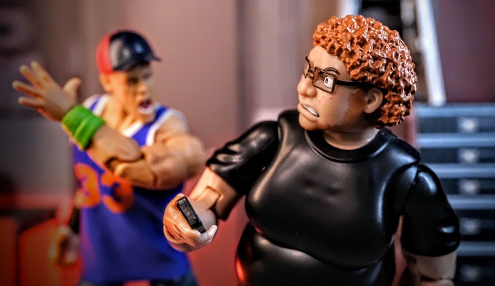 Lloyd Ultimate Wrestling Crowd Fan Figure faces Amazon Exclusive WWE Ultimate Edition John Cena Fan TakeOver action figure in toy photography diorama for WWE, AEW, and collectors.