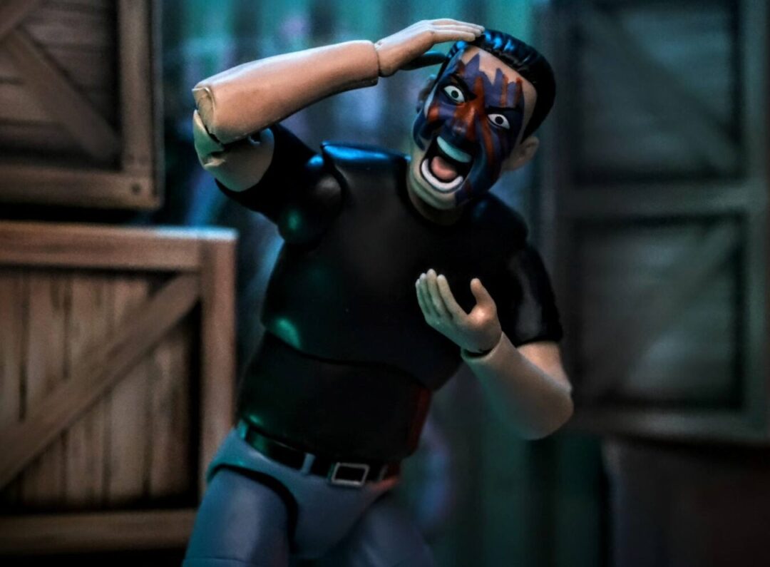 Figures Toy Company Ultimate Wrestling Fan Lance from Series 5 reacting with painted face and dramatic pose backstage