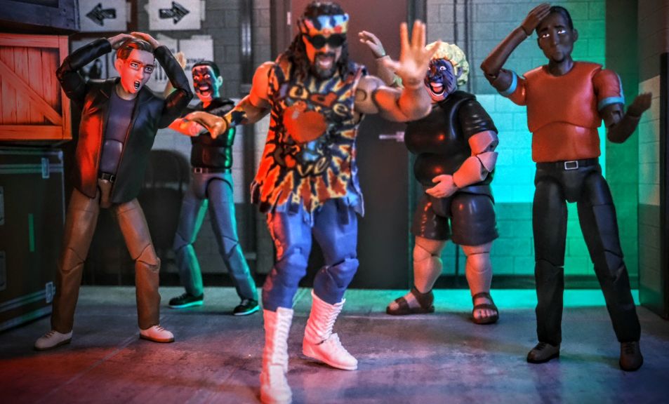 Figures Toy Company Ultimate Wrestling Fans Series 5 posed with Ringside Collectibles WWE Elite Dude Love figure in center