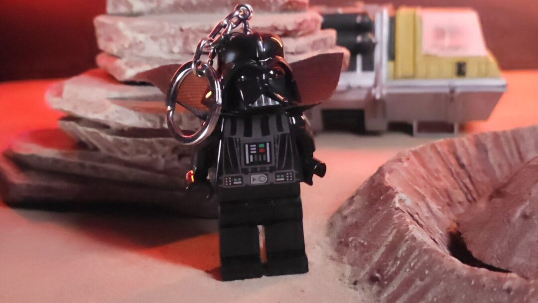 Santoki LEGO Darth Vader Keychain Light Close-Up Close-up of Santoki LEGO Darth Vader Keychain Light with background terrain and sci-fi scenery