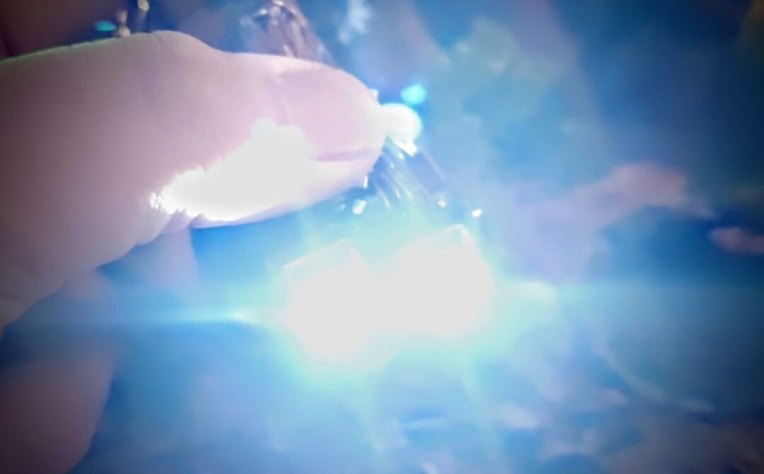 LEGO Chewbacca Keychain LED Light Glowing in Close-Up Shot Close-up of LEGO Chewbacca keychain LED light glowing blue in toy review