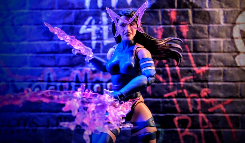 Psylocke Marvel Legends Butterfly Effect Toy Photography Graffiti Backdrop Marvel Legends Psylocke action figure with butterfly psychic energy effect posed in front of graffiti brick wall