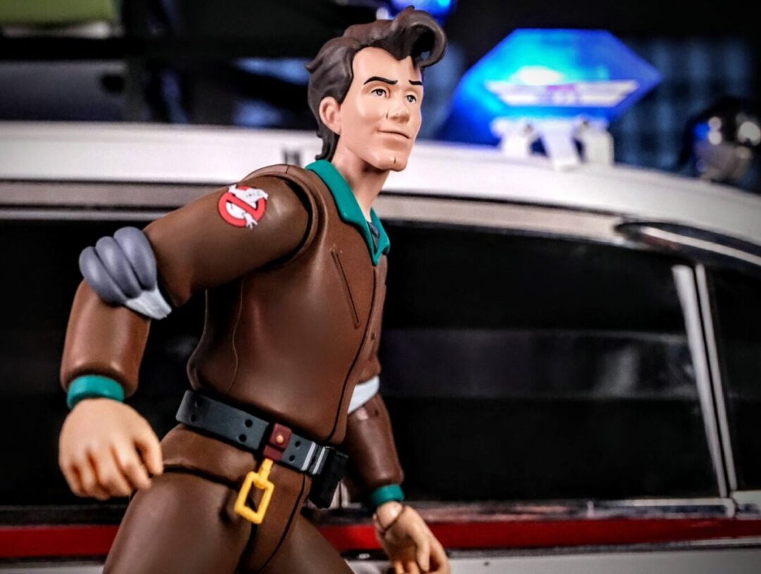 Mondo Toys Real Ghostbusters Peter Venkman and Eaglemoss Ecto-1 Mondo Toys Real Ghostbusters Peter Venkman action figure posed with Eaglemoss Ecto-1 model.