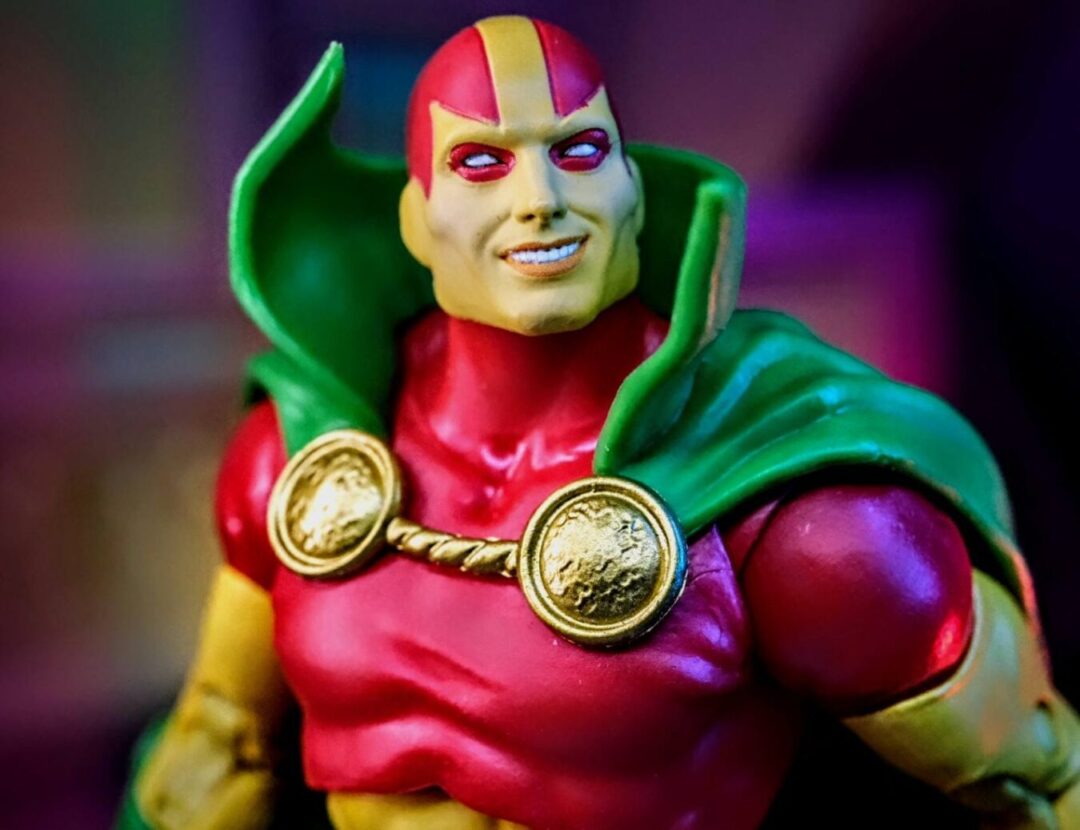 McFarlane Toys Mister Miracle Gold Label Close-Up Close-up of McFarlane Toys DC Multiverse Mister Miracle Gold Label action figure showing chest emblem and head sculpt