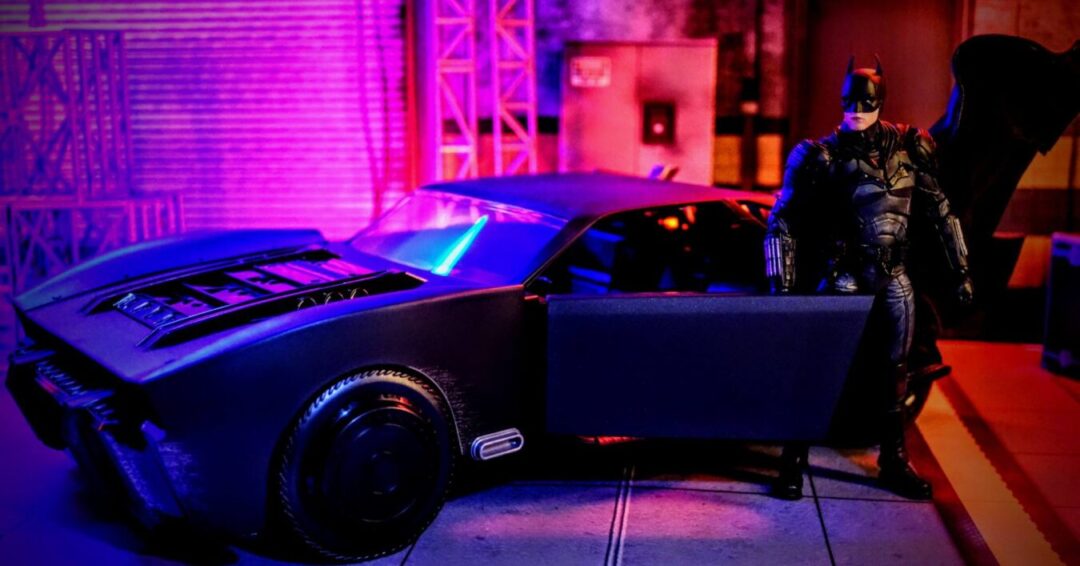 McFarlane Toys DC Multiverse The Batman Batmobile Gold Label with Batman action figure posed beside vehicle