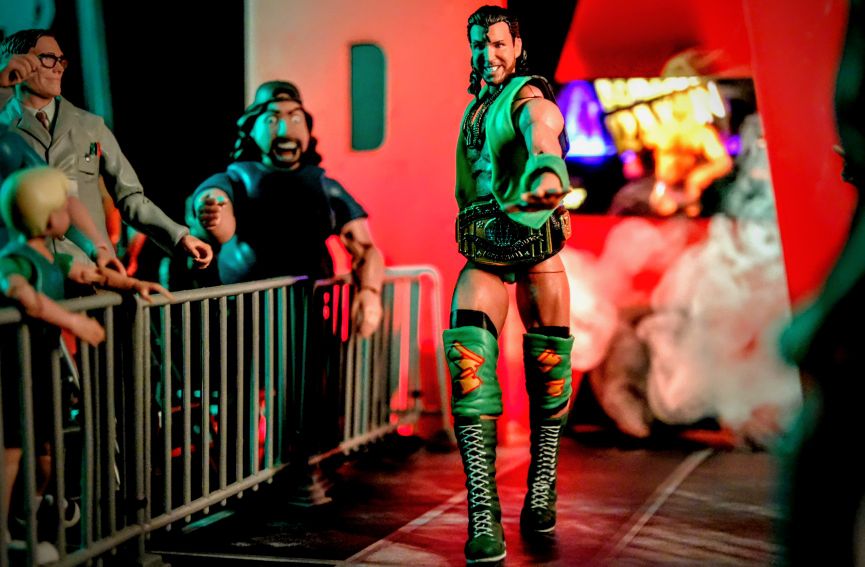 Mattel WWE Ultimates Razor Ramon action figure in green gear making entrance with Intercontinental Championship belt