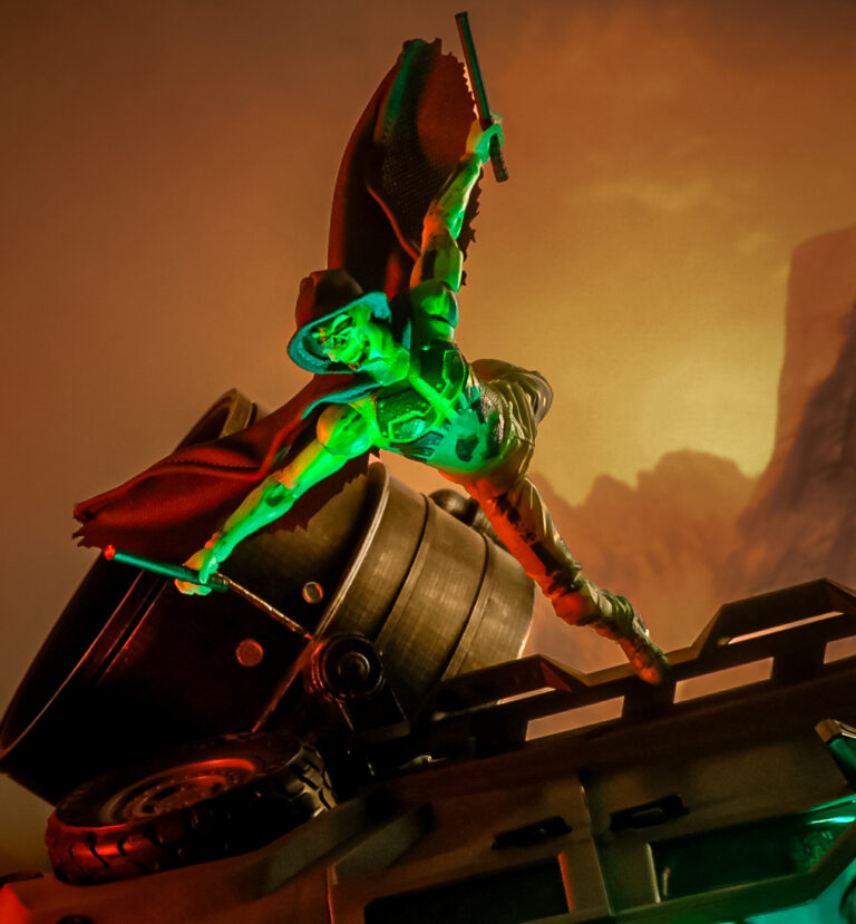 McFarlane Toys Geiger Elite Edition action figure posed over wreckage with radioactive green lighting